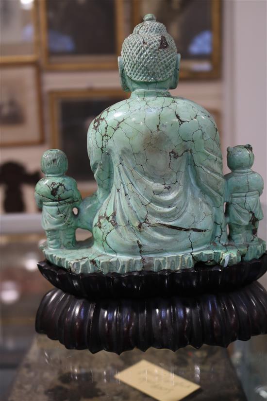 A Chinese turquoise matrix group of a buddha and attendants, circa 1900, 6.75in. 9in. overall